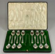 CASED SET OF TWELVE GEORGE V SILVER TEASPOONS & TONGS, with bright cut decoration, Mappin & Webb,