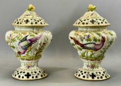 PAIR OF OVOID CENSER VASES with reticulated bases and covers, having fruit finials, bodies painted