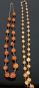 CARNELIAN NECKLACE of nineteen graduated beads, 76cms (l), and another faceted carnelian bead