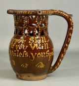 SLIPWARE RETICULATED PUZZLE JUG, possibly Buckley c. 1870, with motto 'Gentlemen now try your skill,