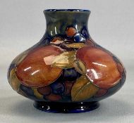 WILLIAM MOORCROFT POMEGRANATE & BERRY PATTERN SQUAT VASE with blue ground, impressed mark, and