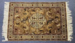 PERSIAN SILK CARPET, decorated with animals and figures, floral border, 106 x 109cms