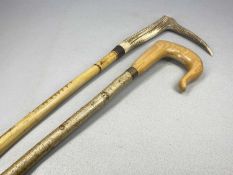 ANTLER HANDLED WALKING STICK, 109cms (l), and a wooden handled shepherd's crook, 136cms (l)