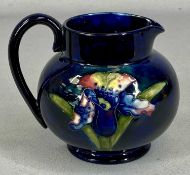 MOORCROFT BLUE IRIS JUG, impressed marks to base, 13.5cms (h)