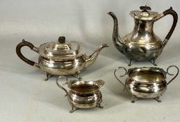 EPNS FOUR-PIECE TEA SERVICE of plain oval form, with ebonised handles and finials