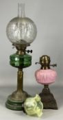 VICTORIAN OIL LAMP, moulded green ceramic base, embossed brass column, faceted green glass reservoir
