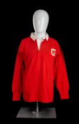 JPR WILLIAMS | LONDON WELSH | 1968-1976 Match-worn jersey in red with white collar, bears felt