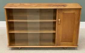 MID-CENTURY BOOKCASE, in the manner of Ercol, with glass sliding doors, labelled 'Priory'