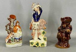 19TH CENTURY STAFFORDSHIRE CERAMICS, including treacle glazed Toby jug 'The Snuff Taker', 25cms (h)