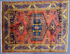 VEIS WOOL CARPET, red / blue ground centre field, 208 x 158cms