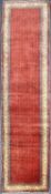ARAAK WOOL CARPET RUNNER, red ground centre field, 430 x 105cms