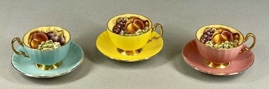 THREE AYNSLEY ORCHARD FRUIT PATTERN CUPS & SAUCERS, in pink, yellow, and blue