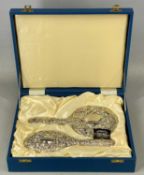 PLUS LOT 46 - CONTEMPORARY SILVER BACKED HAIRBRUSH & HAND MIRROR, with ornate embossed decoration,
