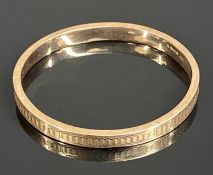 9CT ROSE GOLD HOLLOW BANGLE, with engraved decoration, 72 x 68mms, 10.7g