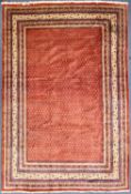 ARAAK WOOL CARPET, red ground centre field, 338 x 225cms
