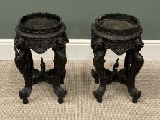 PAIR OF INDIAN CARVED HARDWOOD JARDINIERE STANDS, 51 x 23cms (diam.) Provenance: private