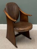 ARTS & CRAFTS' OAK ARMCHAIR having brown leather upholstered seat and back cushions, in the manner