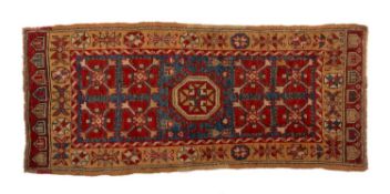 VINTAGE ANATOLIAN WOOL YASTIK, central octagonal star gul with hooked border on indigo field,