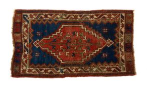 VINTAGE ANATOLIAN WOOL YASTIK, hexagonal stepped foliate madder medallion on indigo field with
