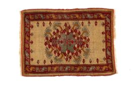 VINTAGE ANATOLIAN WOOL YASTIK, fancy shaped mint green, raspberry, and gold hooked medallion on