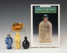 THREE CHINESE SNUFF BOTTLES, OKIMONO & BOOK, comprising black lacquer bottle, blue and white lotus