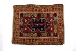 VINTAGE ANATOLIAN WOOL YASTIK, stepped shaped foliate indigo medallion on raspberry field, octagonal