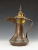LARGE ARABIC DALLAH, brass-mounted copper, 40cms (h) Provenance: The Cornelia Bayley Collection from