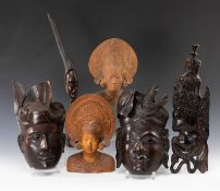 INDONESIAN CARVINGS, including pair wall masks of male and female in traditional headwear 35cms (h),