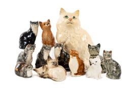 ASSORTED CAT FIGURINES, including seven small Babbacombe seated cats, two Royal Doulton cats, and