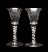 PAIR OF 18TH C. WINE GLASSES, bell shaped bowls engraved with coronets, palms, and monograms in
