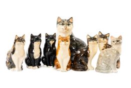 EIGHT BABBACOMBE (DEVON) POTTERY CATS, variously decorated, largest 31cms (h)