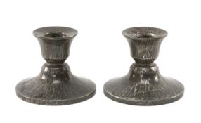 PAIR OF LIBERTY & CO. 'TUDRIC' PEWTER DWARF CANDLESTICKS, shape 01543, planished finish, 8cms (h) (