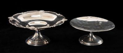 TWO SILVER PEDESTAL TAZZAS, one of plain circular form, the other circular with shell decoration,