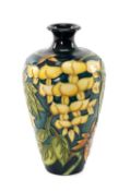 PHIL GIBSON FOR MOORCROFT, 'Wisteria' pattern vase, c. 1998, no. 765, Collectors' Club issue, 15.