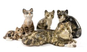 THREE WINSTANLEY CERAMIC CATS, larger prone cat signed and numbered 6, approx. 40cms (w), pale