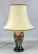 MOORCROFT BALUSTER TABLE LAMP, decorated in the Simeon pattern by Philip Gibson, on turned wooden
