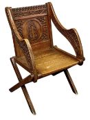 OAK GLASTONBURY CHAIR, late 19th century, initials carved to back with foliate and scroll