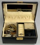 ASSORTED COSTUME JEWELLERY, including bangles, brooches, and rings, contained in a black jewellery