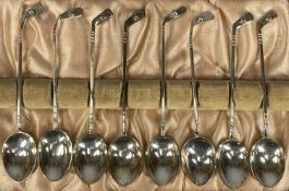 CASED SET OF EIGHT GEORGE V SILVER TEASPOONS, with golf club handles, William J. Holmes,