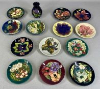 COLLECTION OF CONTEMPORARY MOORCROFT PIECES, including thirteen circular pin trays, 11.5cms (diam.),