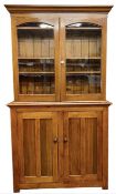 PITCH PINE CUPBOARD BOOKCASE, late 19th century, glazed double doors to the upper section, 228 (h) x