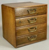 EDWARDIAN OAK TABLETOP CHEST, four drawers with brass drop handles, 31 (h) x 31 (w) x 26cms (d)