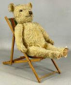 VINTAGE STRAW-FILLED MOHAIR TEDDY BEAR, with growler, 63cms (h), and a vintage doll's deck chair,