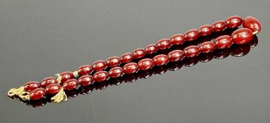 CHERRY AMBER BAKELITE BEAD NECKLACE, largest bead 21 x 13mms, 44cms (l), approx. wt. 26g Provenance: