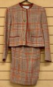 CHANEL CREATIONS LADIES' TWO-PIECE TWEED SUIT, orange, red, and green, size 6 Provenance: private