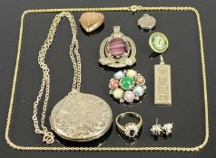 ASSORTED SILVER / WHITE METAL JEWELLERY, including large circular locket with scroll engraved