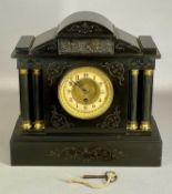 19TH CENTURY BLACK SLATE MANTEL CLOCK of architectural form, with engraved line detail, arched