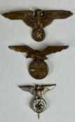 THREE WWII GERMAN BADGES, comprising Waffen SS visor cap eagle, SS / NSDAP eagle tie pin, and a