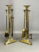 PAIR OF BRASS FIREDOGS/IRON HOLDERS, 54cms tall Provenance: private collection Gwynedd