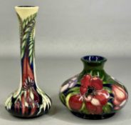 TWO MOORCROFT VASES one with narrow neck, 21cms (h), and onion-shaped, 11cms (h) (2) Provenance: